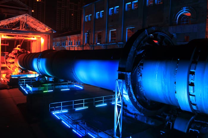 idle cement plant rotary kiln machinery at night